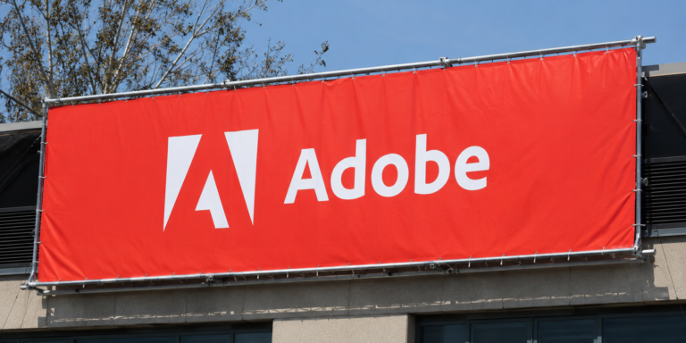 Why is Adobe stock falling despite a revenue and earnings beat?